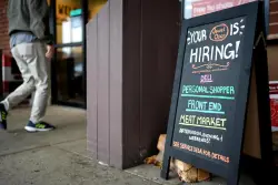 US filings for jobless aid, a proxy for layoffs, inch down modestly last week as uncertainty lingers